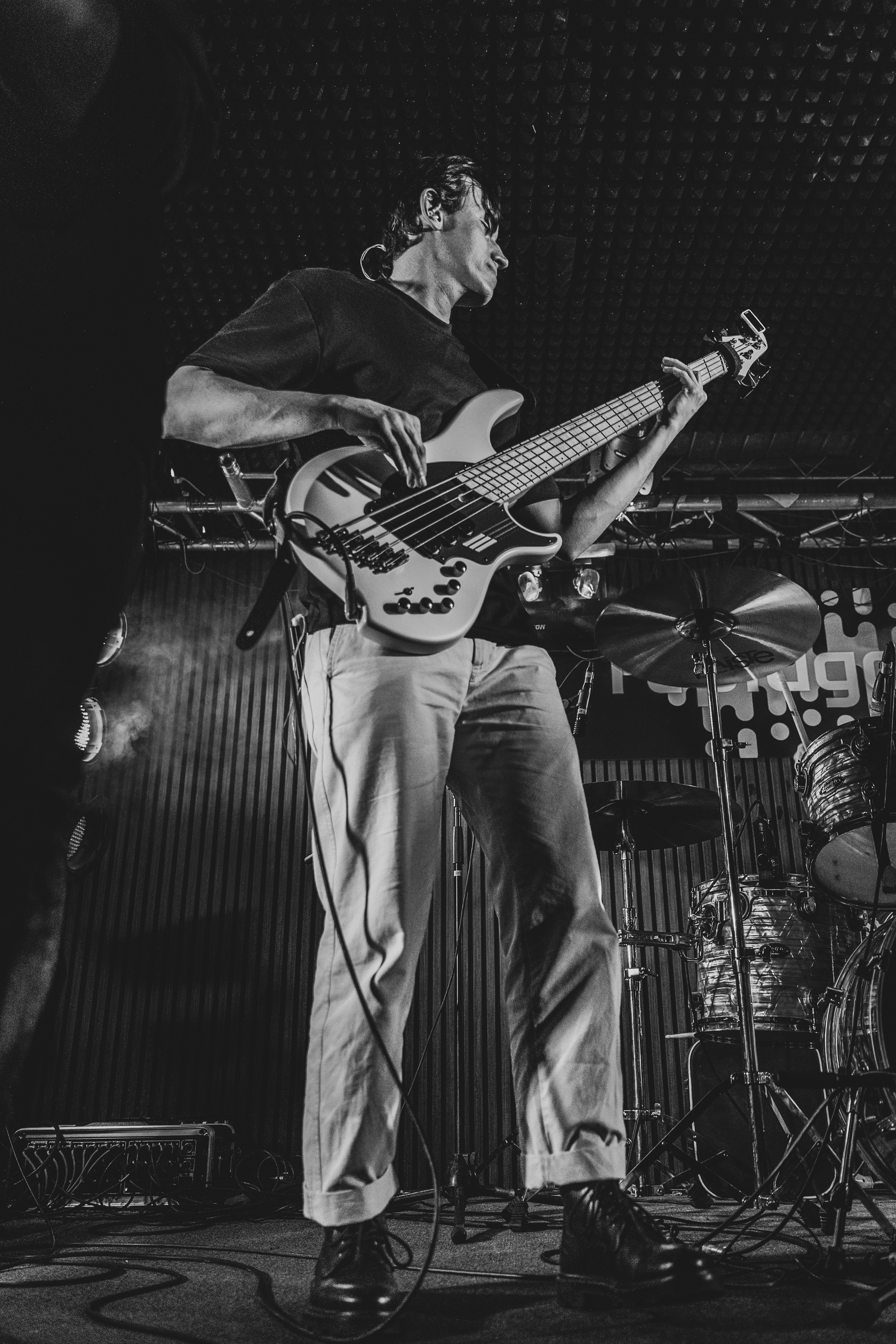 Totor playing bass on stage